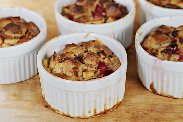 Apple-cranberry bread puddings in molds