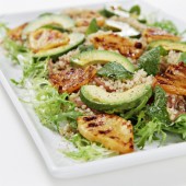 Quinoa salad with avocado, roasted pineapple and pickled shallots