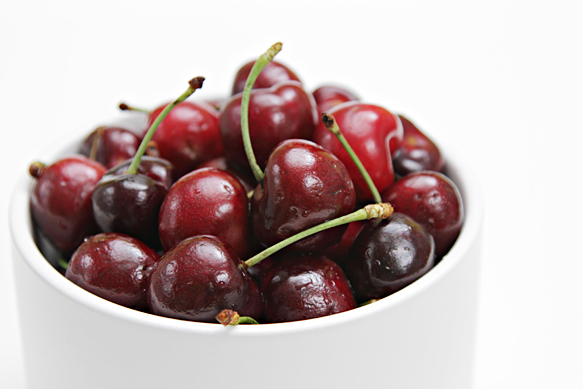 Bing cherries in white bowl